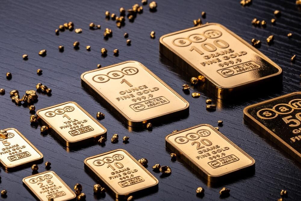 Golden metal bars on beige background